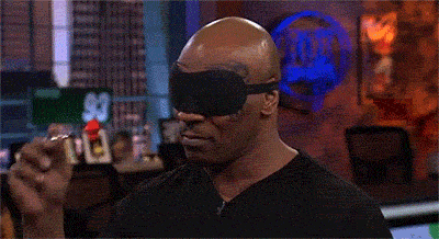 Mike Tyson throwing darts blindfolded